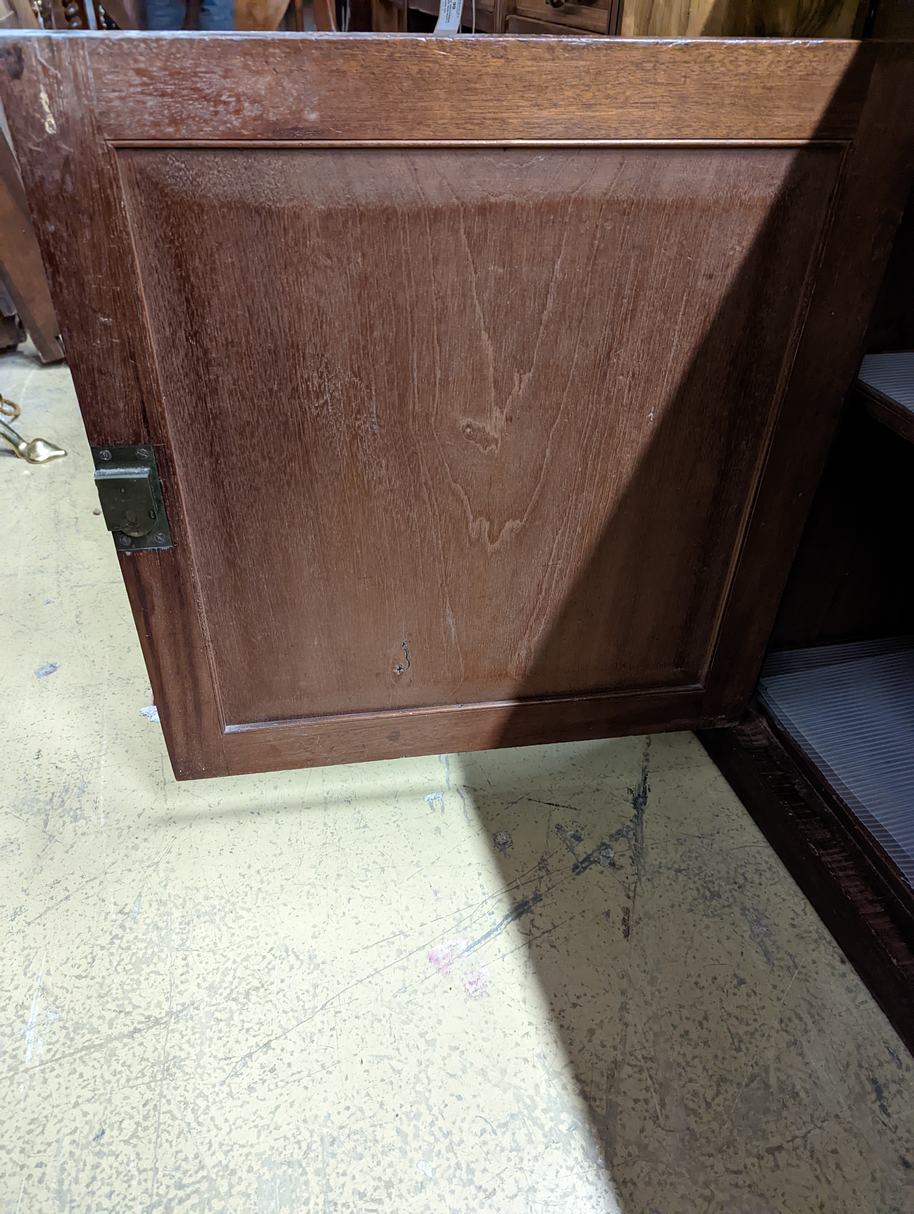 A Regency mahogany low cabinet fitted with two drawers, over a pair of cupboard doors and plinth base, width 138cm, depth 43cm, height 76cm